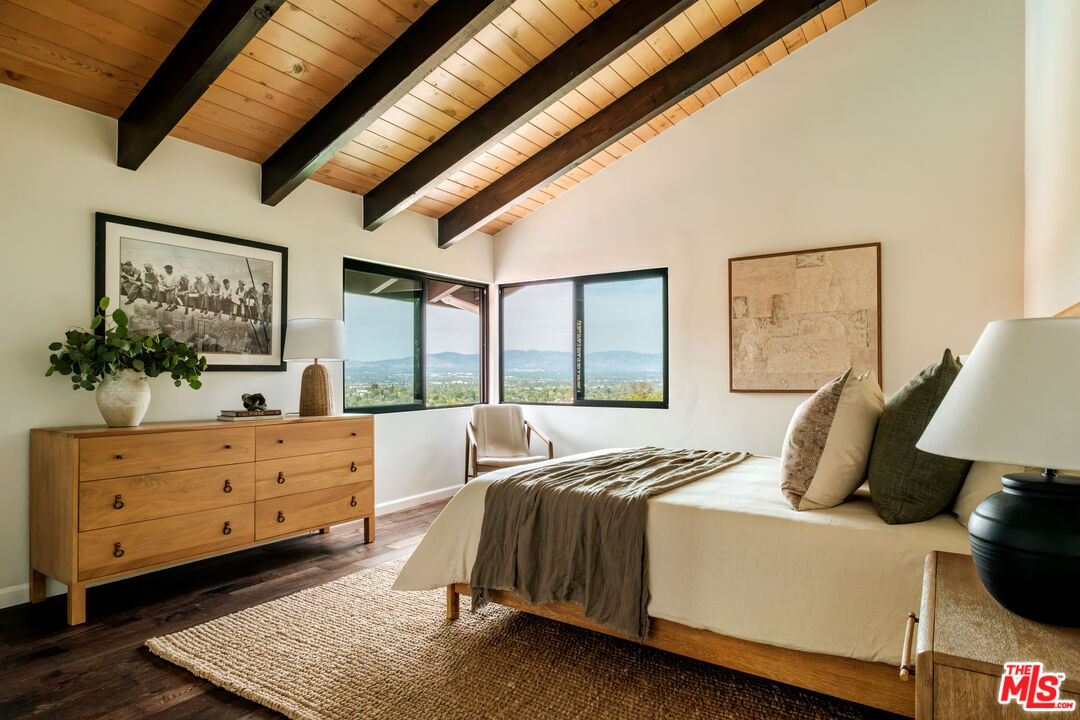 Bedroom with corner windows facing the mountains