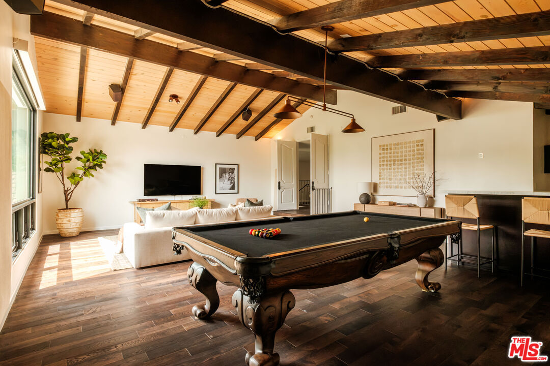 Billiards room with antique pool table