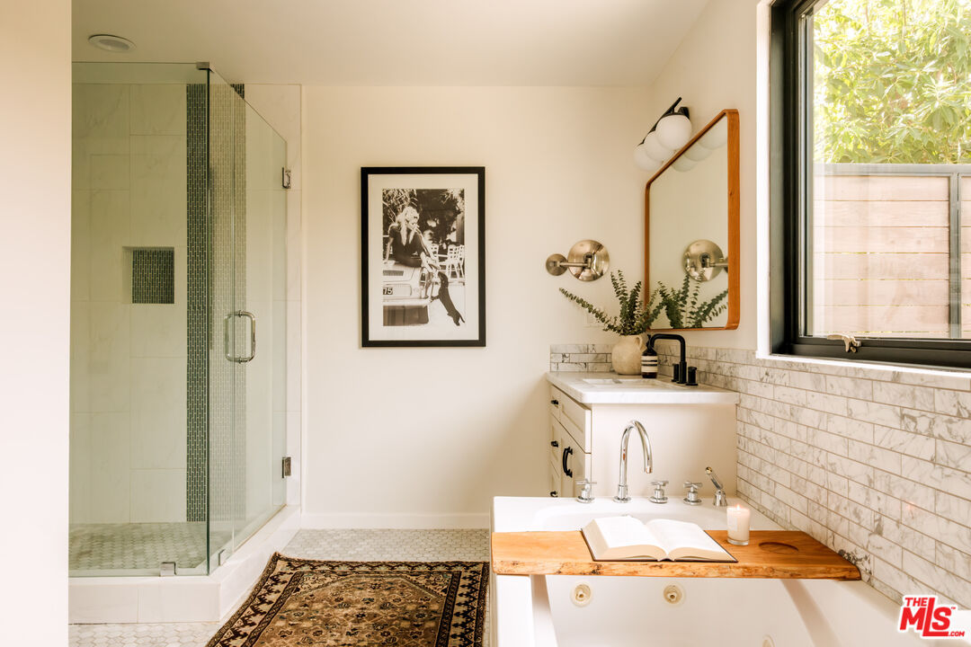 Primary bathroom glass shower and soaking tub