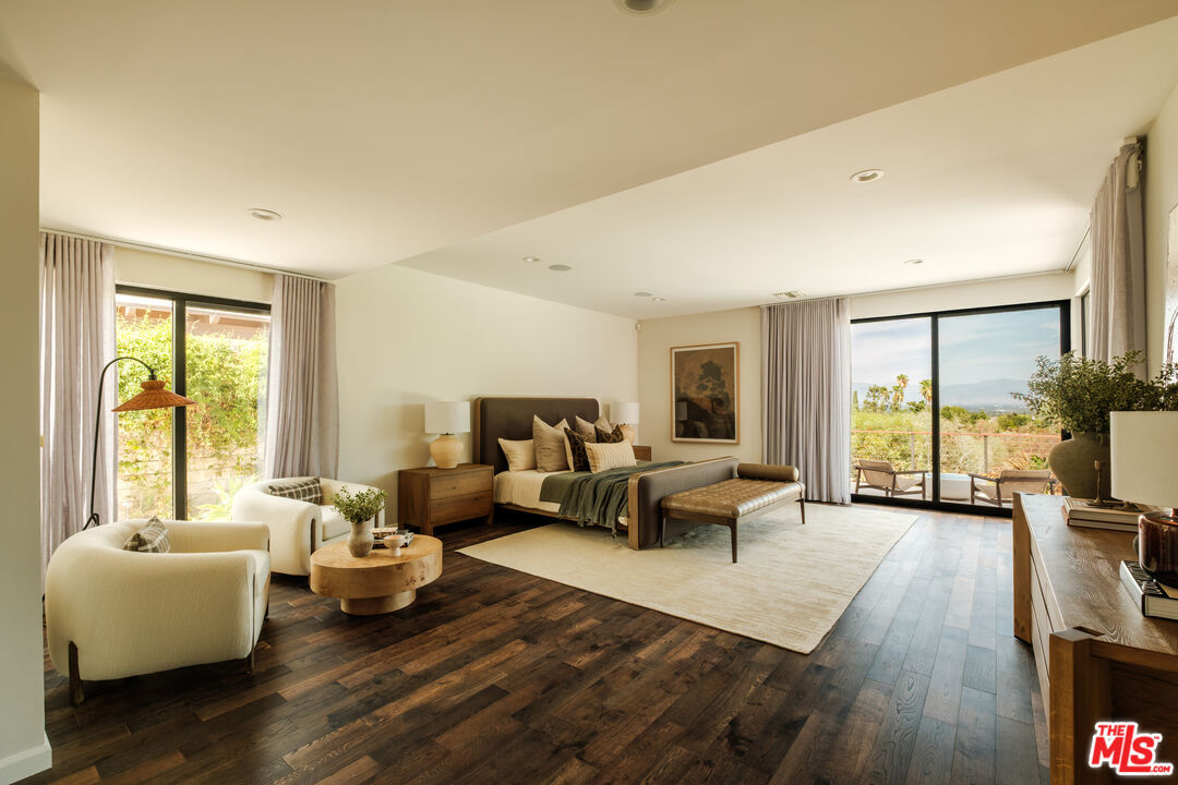 Primary bedroom with corner windows framing the Valley view