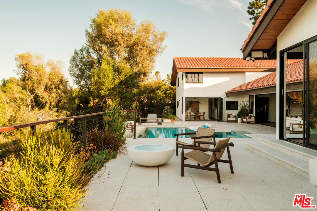 Terrace seating with a panoramic view of the Valley at golden hour